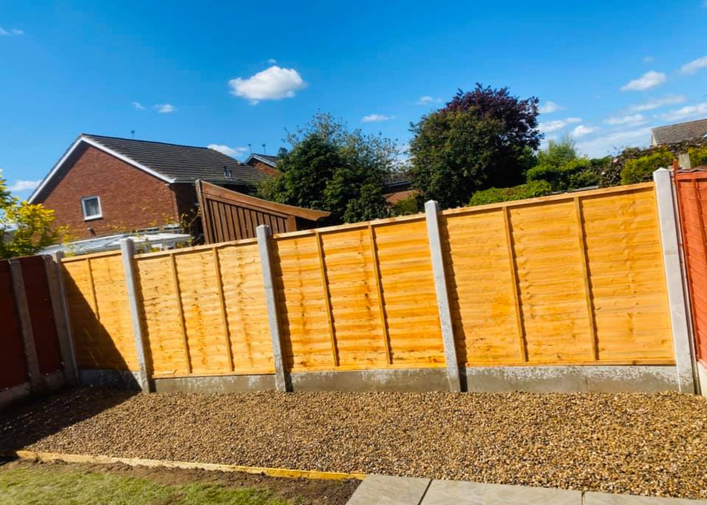 New close board fencing with concrete posts and gravel boards